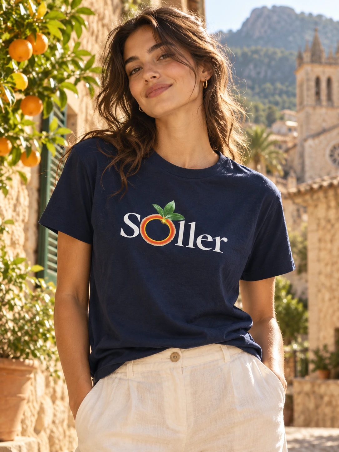 AI-generated editorial photograph of a navy Sóller Citrus Route T-shirt